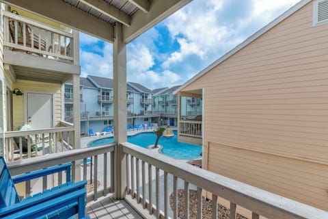 Your private balcony overlooks the sparkling community pool, where sunny days invite refreshing swims and poolside lounging.