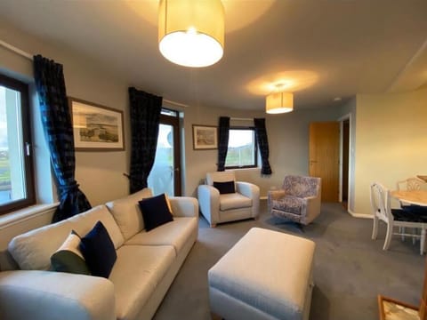 Living Room includes dining area with table seating for six. 