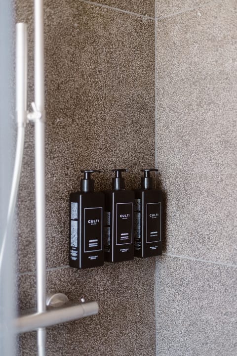 Shower, rainfall showerhead, designer toiletries, hair dryer