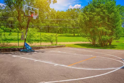Private outdoor basketball court for family fun and friendly games