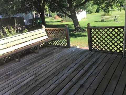 Back patio - access through sliding door in dining room. Tie line for your pup.
