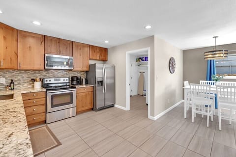 Open kitchen with stainless steel appliances and everything you need to whip up a meal.