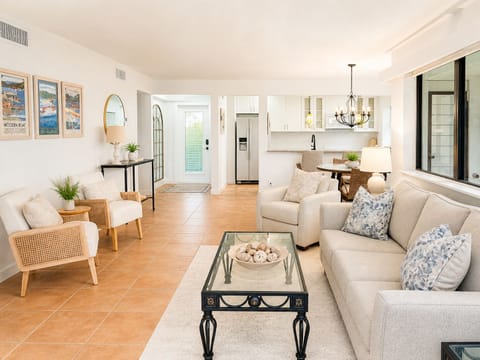 Spacious, open-concept, seamless flow to the dining area & kitchen areas.