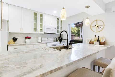 Exquisite quartz countertop, exuding coastal vibes.