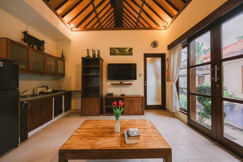 1 Bedroom Suite Villa | Living area | 32-inch flat-screen TV with cable channels, TV