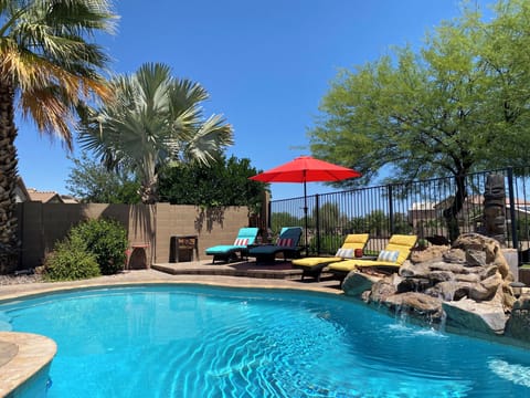 Beautiful, private backyard with a heated pool and view fence.