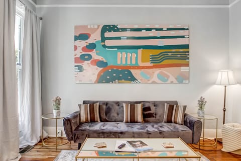 The living room features a sleeper sofa and a ROKU Smart TV.