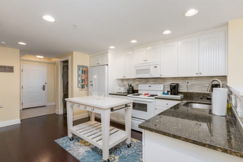 Full kitchen fully stocked with cooking/eating/drinking utensils