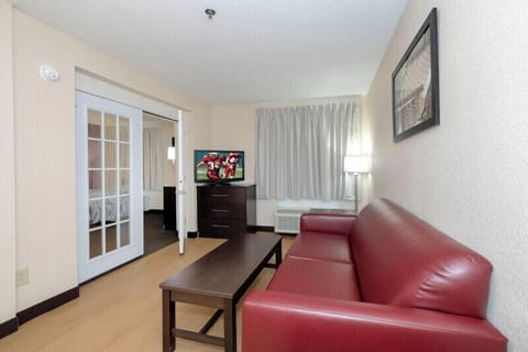 Desk, laptop workspace, blackout drapes, iron/ironing board