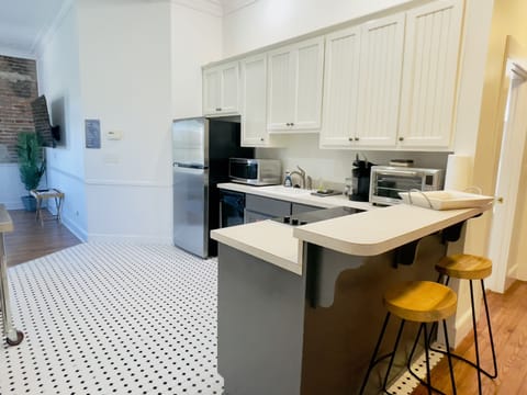 Full Kitchen: fridge, electric stovetop, countertop convection oven