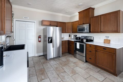 Another angle showcasing kitchen layout & easy access to backyard door