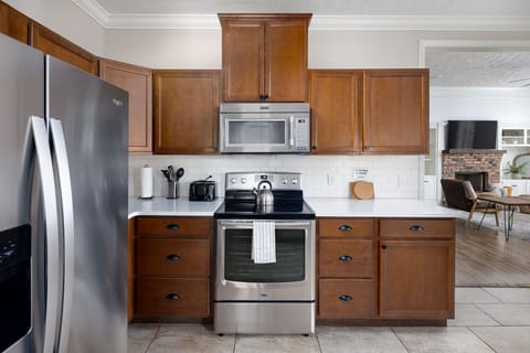 View standing at the sink, highlighting countertops and appliances