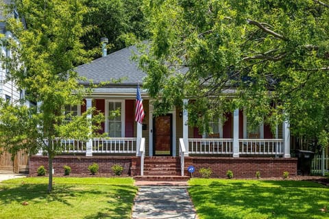 Classic Craftsman exterior with brick staircase leading to fully covered porch