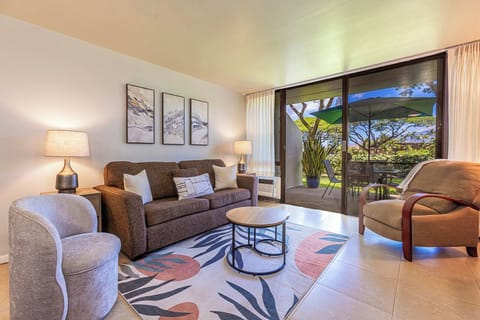 Sink into your private retreat with views of lush gardens and open sky just beyond your patio doors, where indoor comfort meets island serenity.