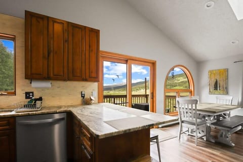 Kitchen: Stainless steel appliances, drip coffee maker, Keurig, Crockpot, cooking utensils, tableware