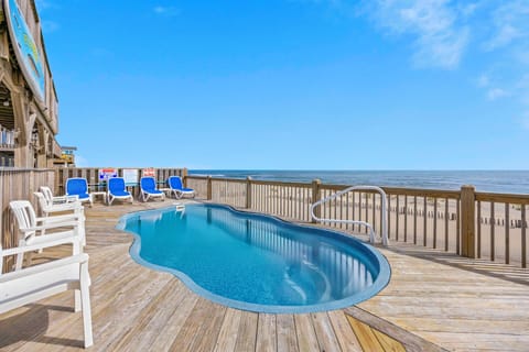 Your private oceanfront pool deck offers unparalleled relaxation with stunning sea views and comfortable lounging chairs.