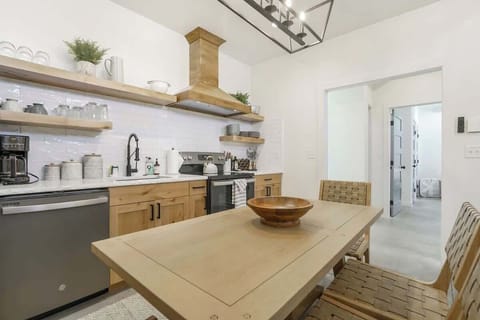 Create culinary magic in this contemporary kitchen featuring top-of-the-line appliances.