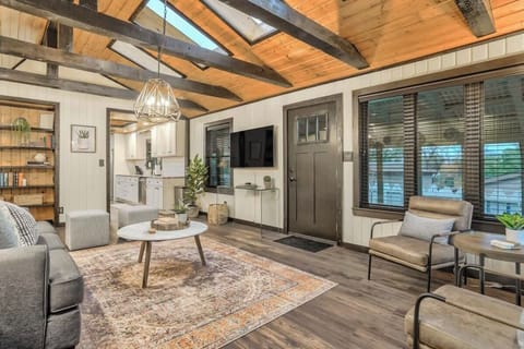 Designed for Your Comfort and Enjoyment! The Living Room Boasts a Cozy Sofa, Smart TV, Lamps, and Beautiful Lighting to Enhance Your Perfect Vacation Experience.