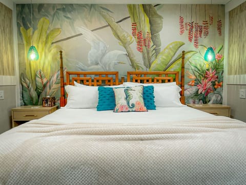 Master bedroom with King sized bed, large smart TV and en-suite bathroom.