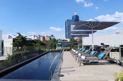 Outdoor pool, open 10:00 AM to 8:00 PM, pool umbrellas, sun loungers