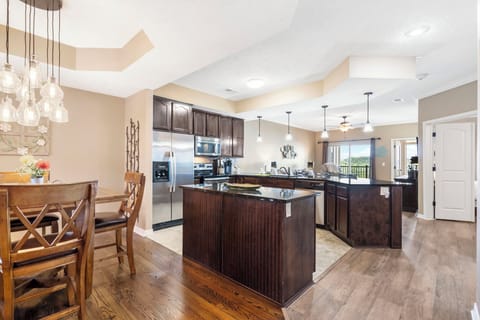 The Open Floor Plan Includes a Full Kitchen, Comfortable Living Area, and Access to a Sunroom Plus an Open Deck!