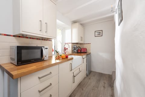 Separated from the lounge with staircase up - Eastleigh Cottage