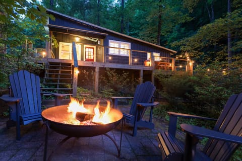 Outdoor Fire Pit Retreat: Gather 'round the fire, unwind and connect amid twinkling lights and nature!