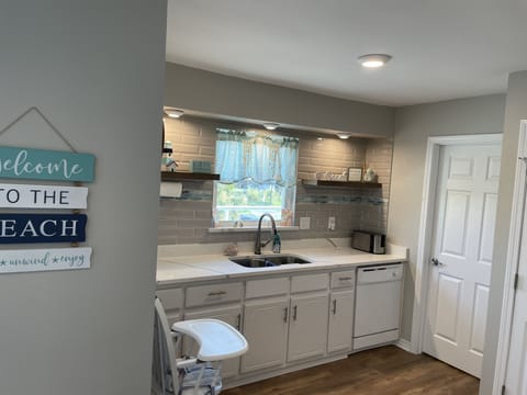 Kitchen with window looking out toward the beach