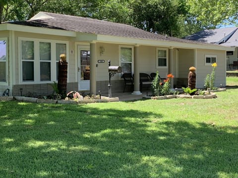 Exterior with seating area and nice landscaping 