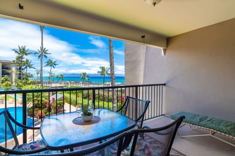 Relax on your private lanai at Hale Ono Loa 204 🌴 Enjoy the soothing sounds of the Pacific Ocean and beautiful coastal scenery.
