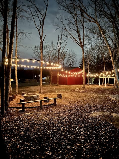 Sit around the fire pit under the beautiful string lights overhead!