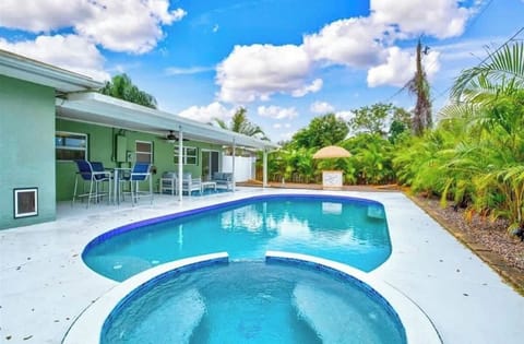 Your backyard oasis awaits...total privacy with a heated pool and hot tub.