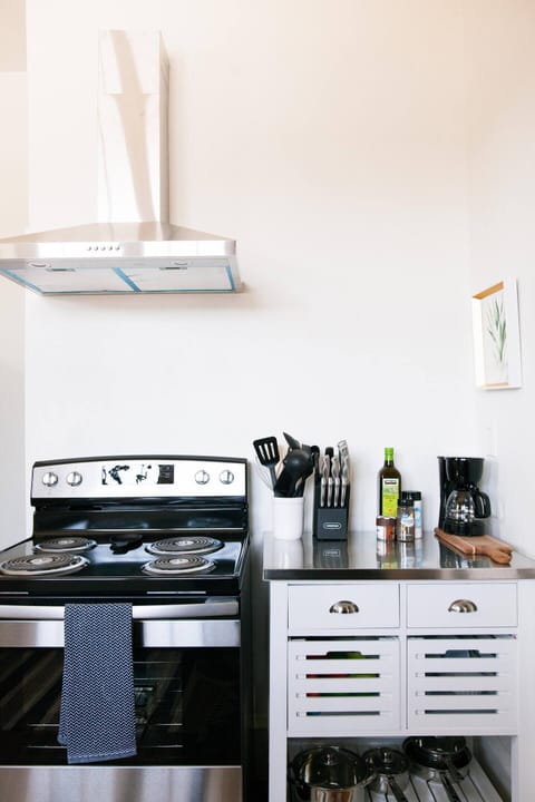 Stainless appliances adorn this 1920's kitchen