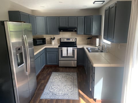 Fully equipped kitchen that overlooks the deck and lake.