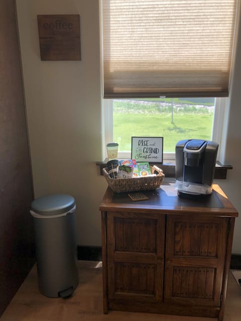 Fully stocked coffee bar with Keurig coffee maker.