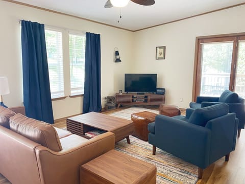 The living room features all new furniture as of 2022.