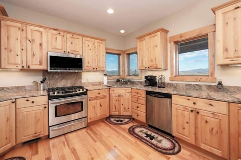 Kitchen with new appliances and everything you need to make a large family meal. 