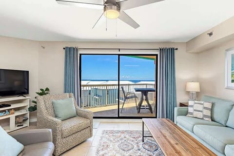 (LIVING ROOM)  Enjoy morning coffee on the private balcony, relax in stylish coastal décor, and unwind in the comfy seating area with large sliding glass doors that bring the beach right to you. ☀️
