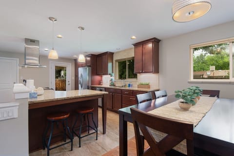 Experience the open concept design as the kitchen flows seamlessly into the dining area.