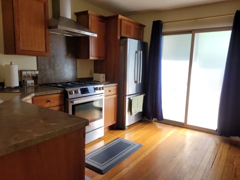 Kitchen with Prosumer appliances, cherry wood cabinets