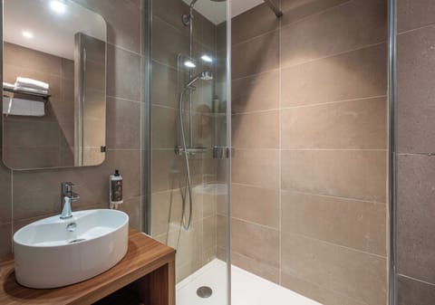 Comfort Room | Bathroom | Hair dryer, towels, soap, shampoo