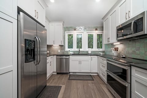 Gorgeous renovated kitchen with stainless steel appliances.