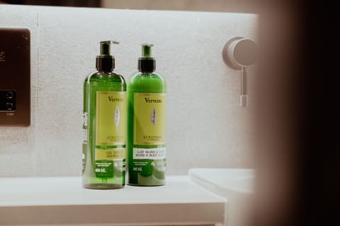 Shower, rainfall showerhead, designer toiletries, hair dryer