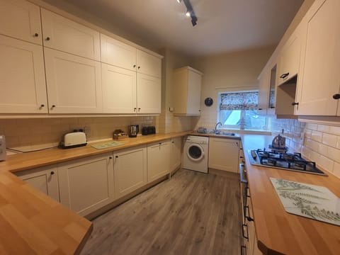 A modern and stylish kitchen can be found at the rear of the property