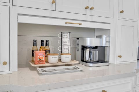 The kitchen is a chef's dream with plenty of space for cooking and preparation featuring incredible views of the inlet.