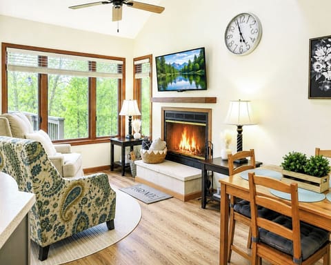 Cozy rustic living room with woodburning fireplace