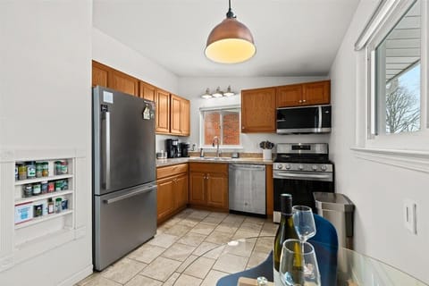 Cook with ease in a fully stocked kitchen with new modern appliances.