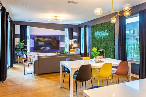 Bright Living Area With A Large Smart TV And Modern Dining Space