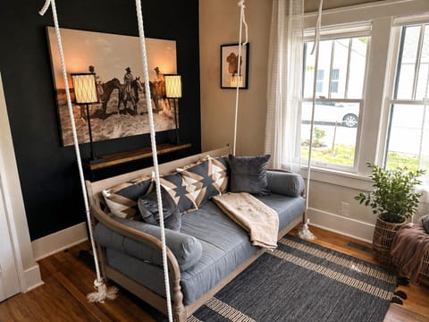 Hanging daybed swing.  This is suitable for a child to sleep on if needed.