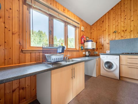 Cabinetry, Countertop, Property, Kitchen, Kitchen Appliance, Wood, Window, Tap, Kitchen Stove, Interior Design